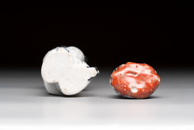 A Chinese Dehua blanc de Chine libation cup, a famille rose cup and two figures, 19th C.