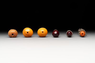 Four Ottoman silver niello cigarette holders with amber and cherry amber, and two hookah mouthpieces for the Islamic market, 19th C.