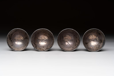 Four Chinese carved and silver-lined coconut cups, 19/20th C.