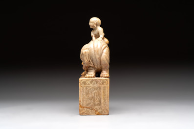 A Chinese soapstone carving of a boy riding an elephant, 20th C.