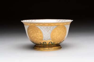 A Chinese European-decorated gilt bronze-mounted blue and white reticulated bowl, Transitional period