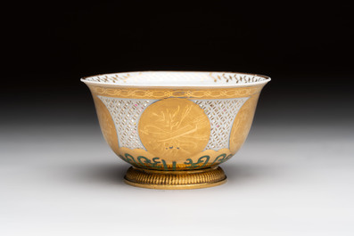A Chinese European-decorated gilt bronze-mounted blue and white reticulated bowl, Transitional period