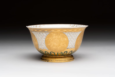 A Chinese European-decorated gilt bronze-mounted blue and white reticulated bowl, Transitional period