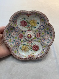 A Chinese famille rose moulded teapot and stand with floral design, Yongzheng/Qianlong