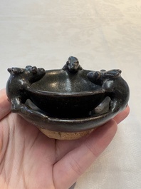 A rare Chinese black-glazed two-tier oil lamp with three rats, Ming