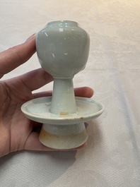 A pair of white-glazed oil lamps, a Longquan celadon vase and Yaozhou celadon box and cover, Ming/Qing