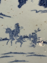 A Chinese blue and white circular plaque with two figures in a landscape, 19/20th C.