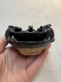 A rare Chinese black-glazed two-tier oil lamp with three rats, Ming