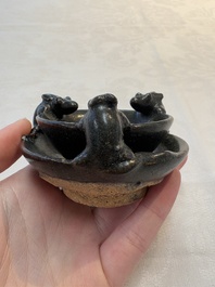 A rare Chinese black-glazed two-tier oil lamp with three rats, Ming