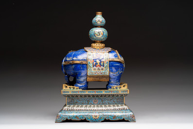 A Chinese lapis lazuli and cloisonn&eacute; elephant on stand, 19/20th C.