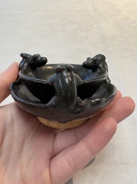 A rare Chinese black-glazed two-tier oil lamp with three rats, Ming