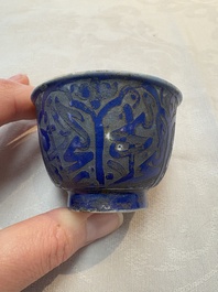 A rare pair of Chinese sacrificial blue-glazed and engraved cups for the Islamic market, 18th C.