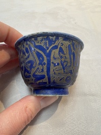 A rare pair of Chinese sacrificial blue-glazed and engraved cups for the Islamic market, 18th C.