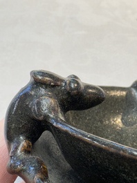 A rare Chinese black-glazed two-tier oil lamp with three rats, Ming