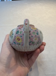 A Chinese famille rose moulded teapot and stand with floral design, Yongzheng/Qianlong