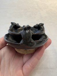 A rare Chinese black-glazed two-tier oil lamp with three rats, Ming