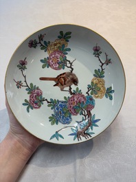 A pair of Chinese Dutch-decorated plates with birds among flowering branches, 18th C.