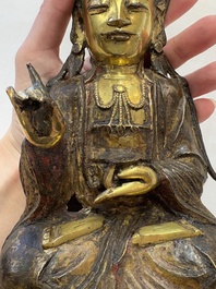 A Chinese parcel-gilt bronze Guanyin, Ming