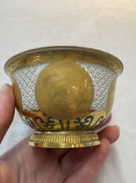 A Chinese European-decorated gilt bronze-mounted blue and white reticulated bowl, Transitional period
