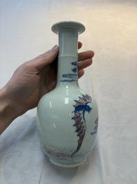 A pair of Chinese blue, white and copper-red 'bats among the clouds' vases, 19th C.