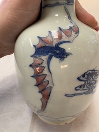 A pair of Chinese blue, white and copper-red 'bats among the clouds' vases, 19th C.
