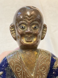 A Chinese champlev&eacute; figure of Luohan, Qianlong mark, 18/19th C.