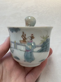 A Chinese Dehua blanc de Chine libation cup, a famille rose cup and two figures, 19th C.