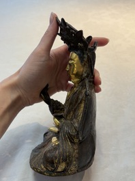 A Chinese parcel-gilt bronze Guanyin, Ming