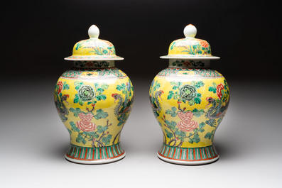 A pair of Chinese famille verte yellow-ground 'pheasants and peonies' vases and covers, 19th C.