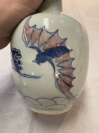 A pair of Chinese blue, white and copper-red 'bats among the clouds' vases, 19th C.