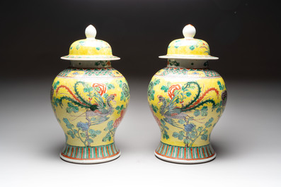 A pair of Chinese famille verte yellow-ground 'pheasants and peonies' vases and covers, 19th C.