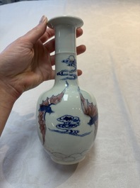 A pair of Chinese blue, white and copper-red 'bats among the clouds' vases, 19th C.