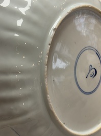 A Chinese blue and white dish with floral design, artemisia leaf mark, Kangxi