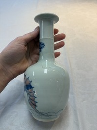 A pair of Chinese blue, white and copper-red 'bats among the clouds' vases, 19th C.