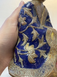 A Chinese champlev&eacute; figure of Luohan, Qianlong mark, 18/19th C.