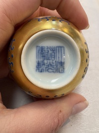A pair of Chinese gilt-and blue-enamelled 'shou 壽' cups, Daoguang mark and possibly of the period
