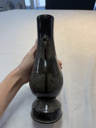 A fine Chinese archaistic bronze 'hu' vase with dragon handles, Yuan
