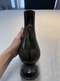 A fine Chinese archaistic bronze 'hu' vase with dragon handles, Yuan