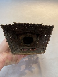A Nepalese gilt-bronze Buddha on an inscribed throne with a mandorla, 19th C.