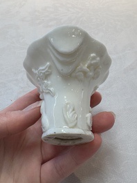 A Chinese Dehua blanc de Chine libation cup, a famille rose cup and two figures, 19th C.