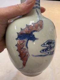 A pair of Chinese blue, white and copper-red 'bats among the clouds' vases, 19th C.