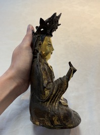 A Chinese parcel-gilt bronze Guanyin, Ming