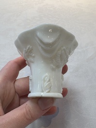 A Chinese Dehua blanc de Chine libation cup, a famille rose cup and two figures, 19th C.