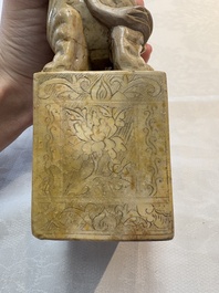 A Chinese soapstone carving of a boy riding an elephant, 20th C.