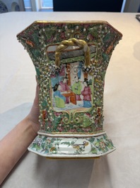 A pair of Chinese Canton famille rose flower holders and covers with figural design, 19th C.