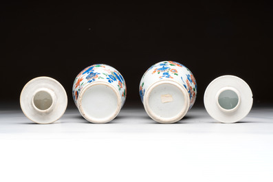 A pair of Chinese verte-Imari 'birds among flowering branches' vases and covers, Kangxi