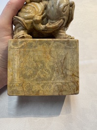 A Chinese soapstone carving of a boy riding an elephant, 20th C.