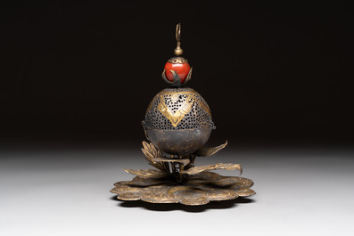 An Ottoman gilt-bronze inscribed incense burner with a red stone, 19th C.