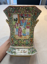A pair of Chinese Canton famille rose flower holders and covers with figural design, 19th C.