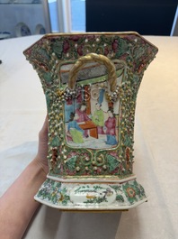 A pair of Chinese Canton famille rose flower holders and covers with figural design, 19th C.